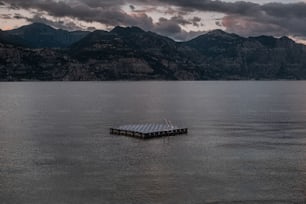 a boat floating on top of a large body of water