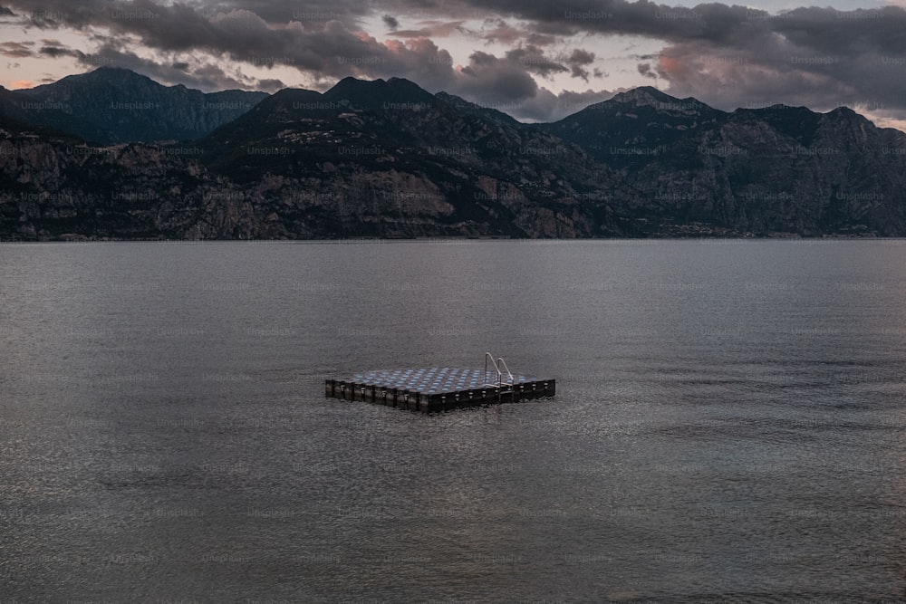 a boat floating on top of a large body of water