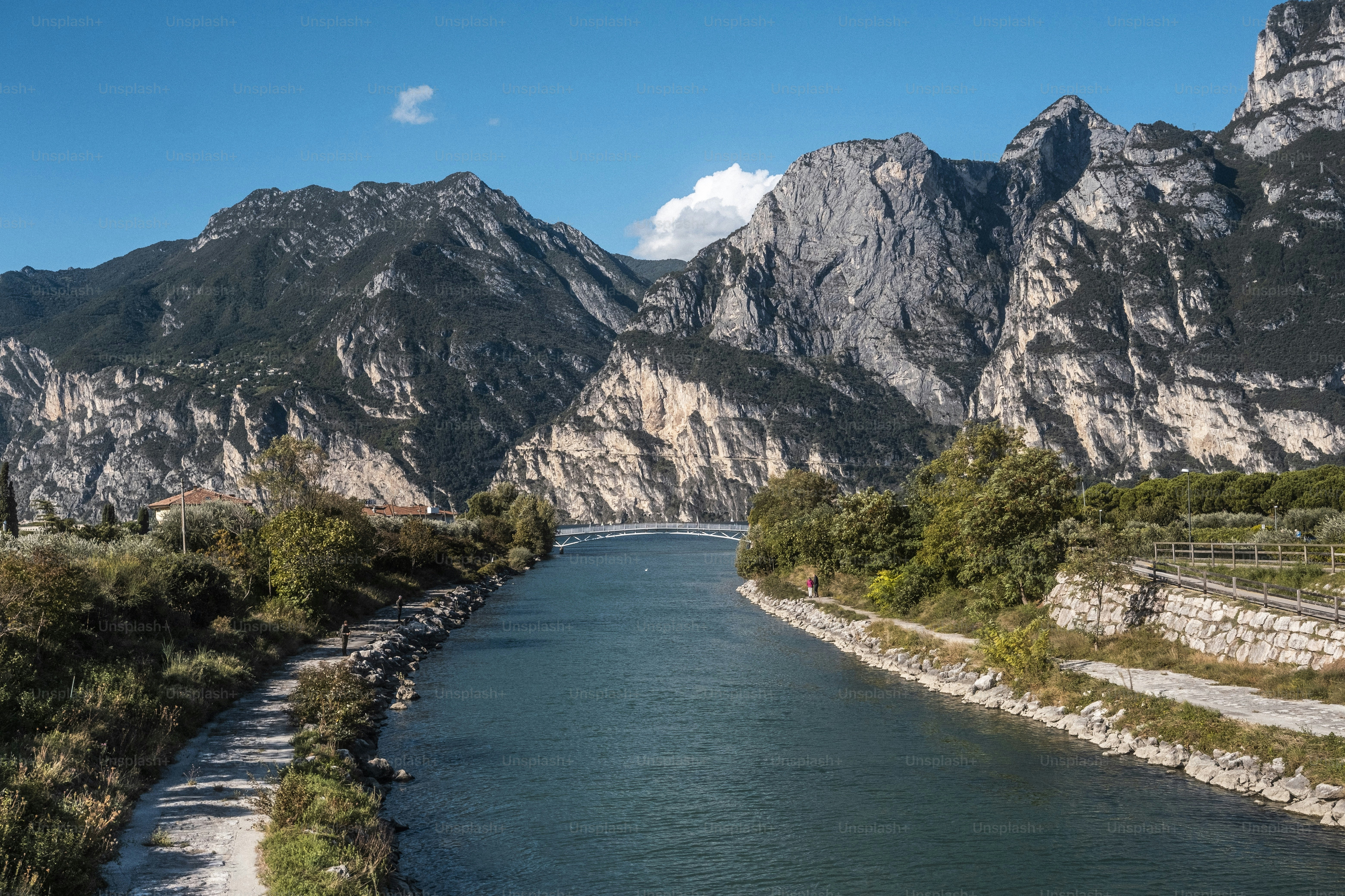 a river running through a lush green valley