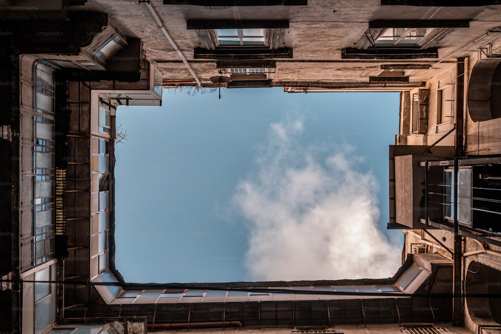 a view of the sky from inside a building