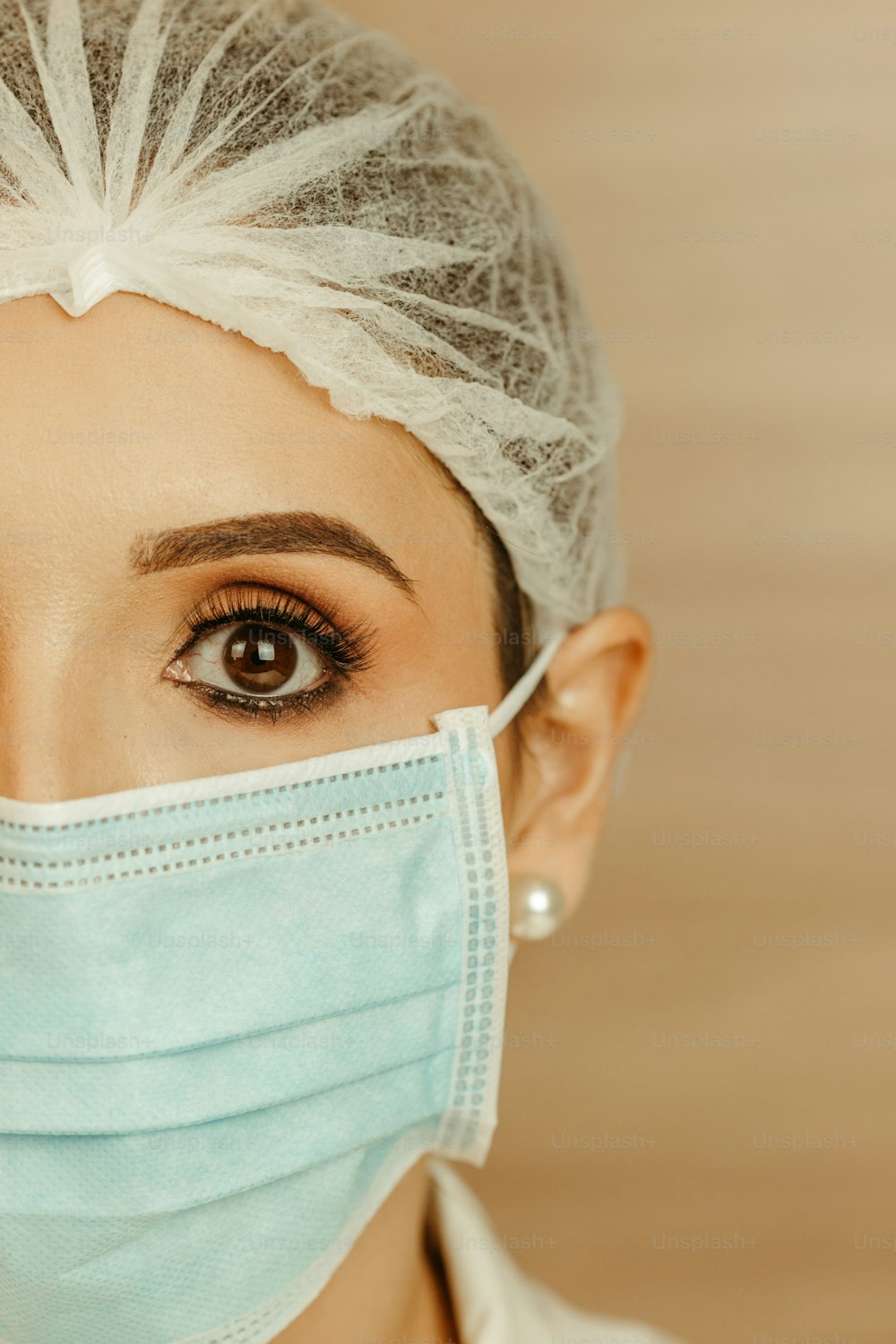 a woman with a surgical mask on her face