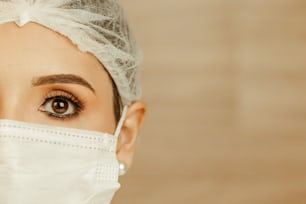 a woman wearing a surgical mask and a headband