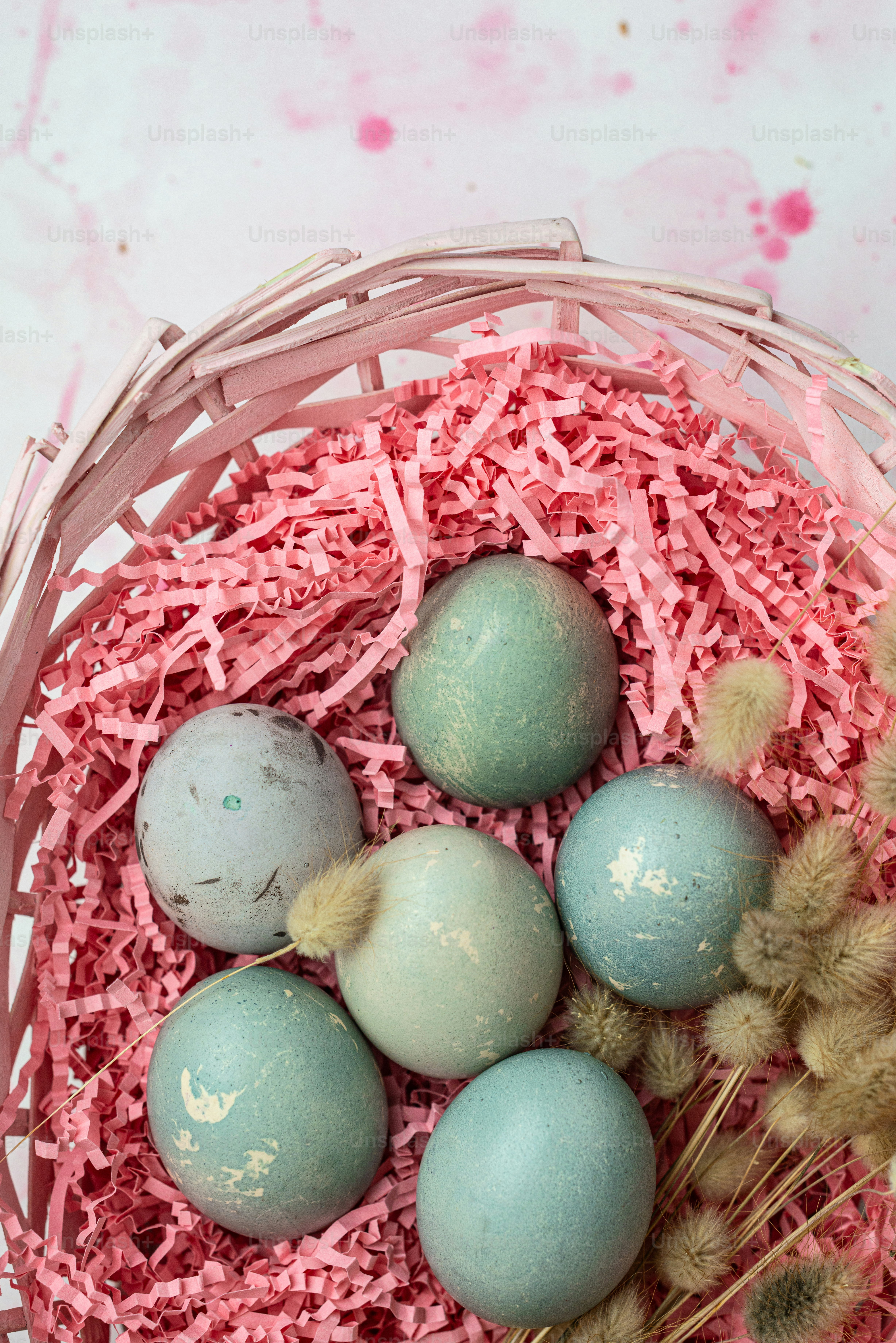 a basket filled with eggs sitting on top of a table