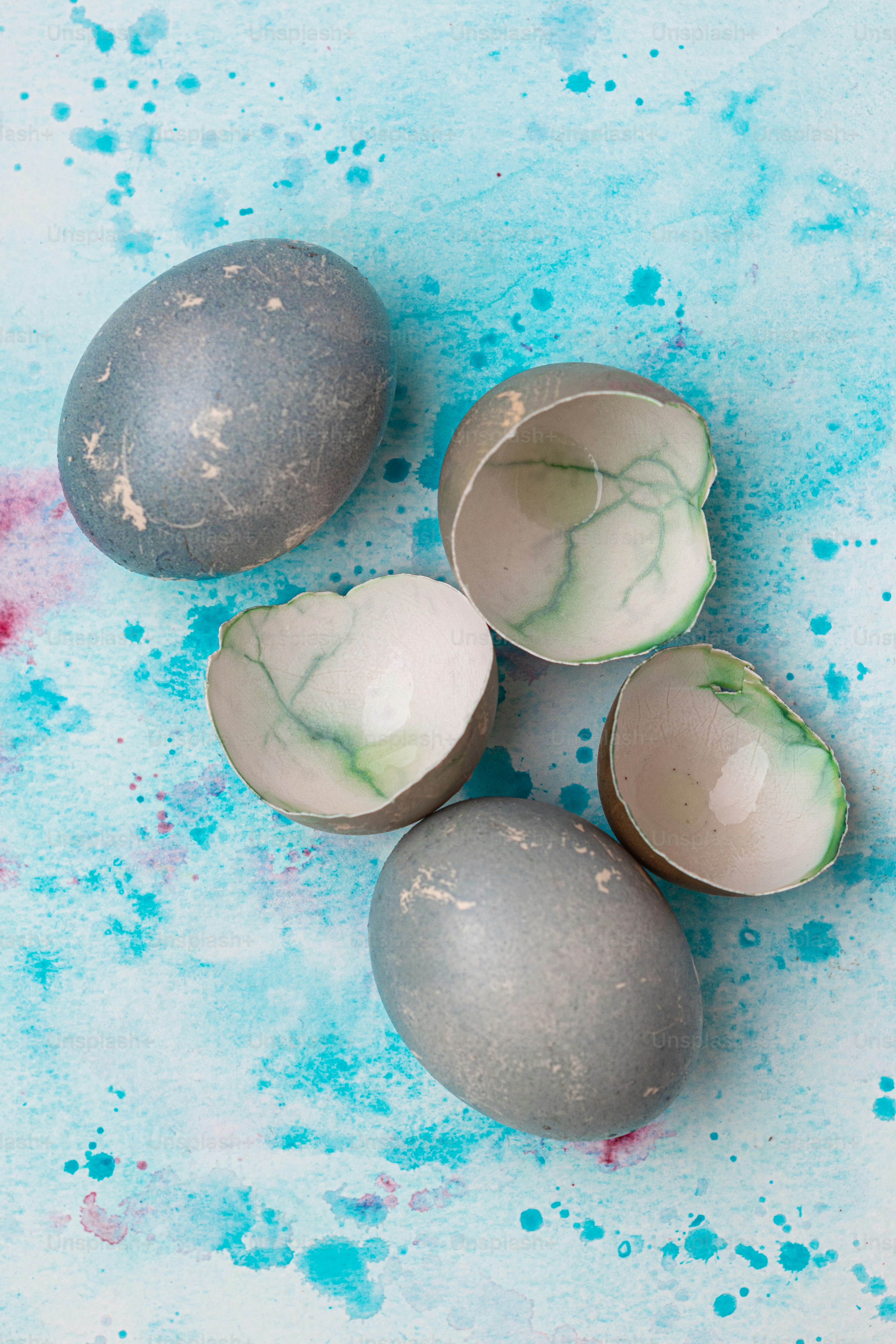 a group of three eggs sitting on top of a table