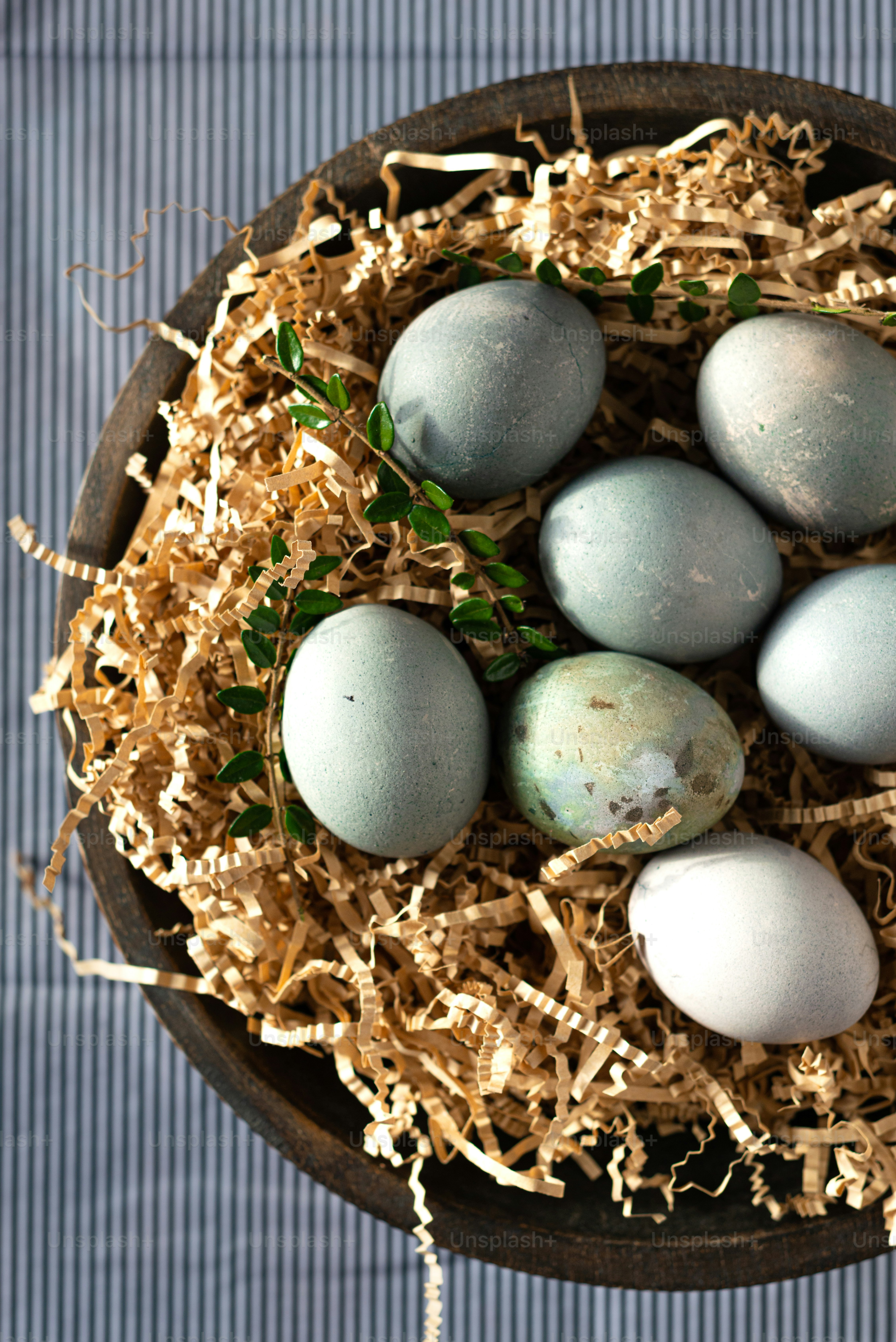 a bowl filled with eggs sitting on top of a table