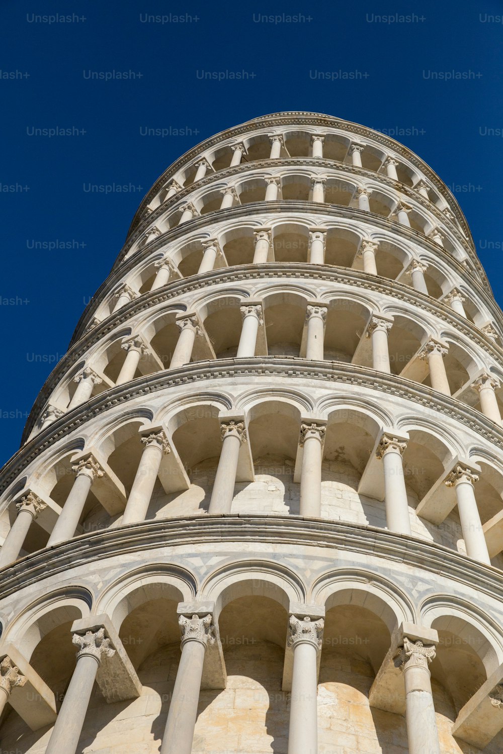 a very tall tower with many arches and pillars