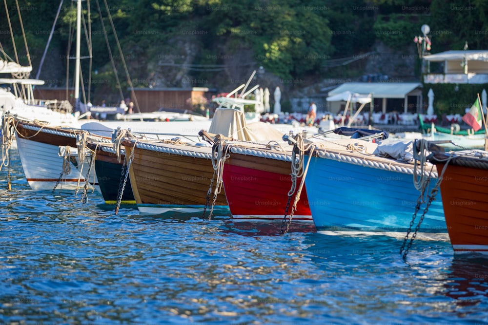 a row of boats docked at a marina