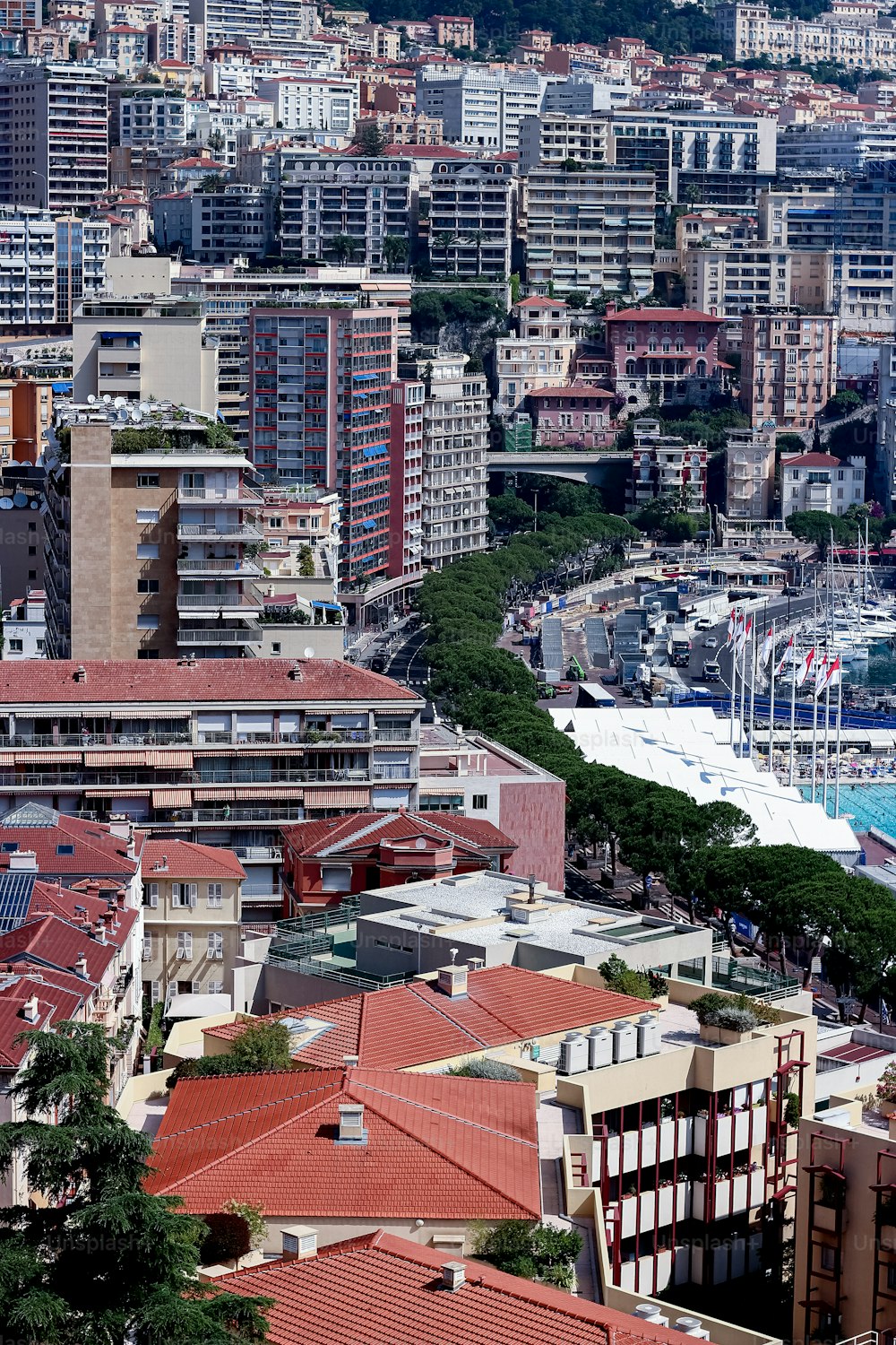 a city with lots of tall buildings next to a body of water