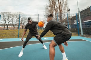 a couple of people on a court with a ball