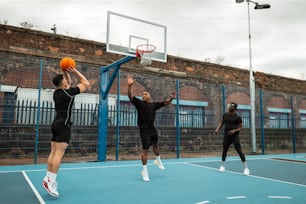 a group of men playing a game of basketball