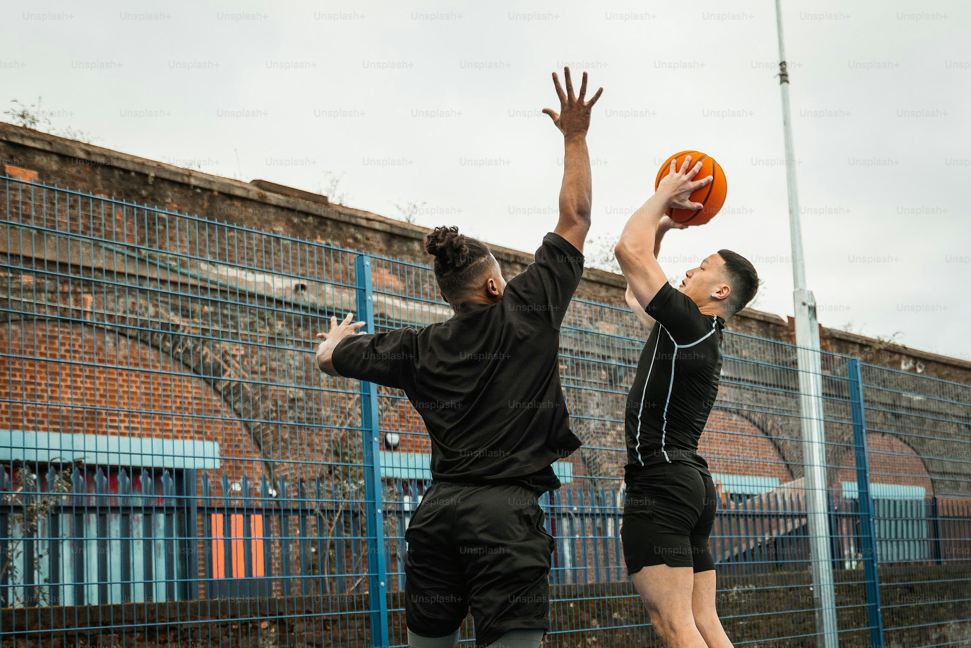 a couple of men playing a game of frisbee