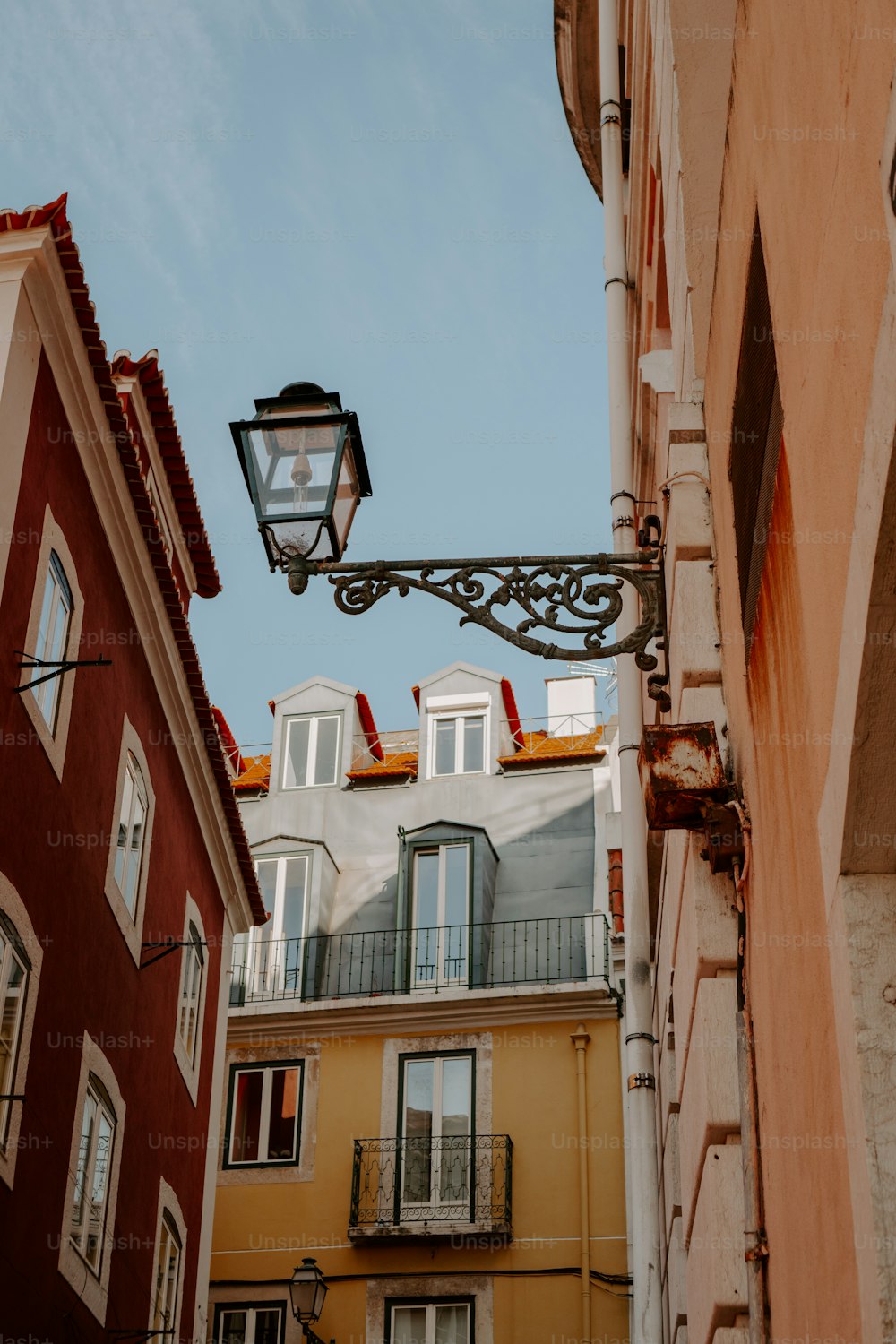 a street light hanging from the side of a building