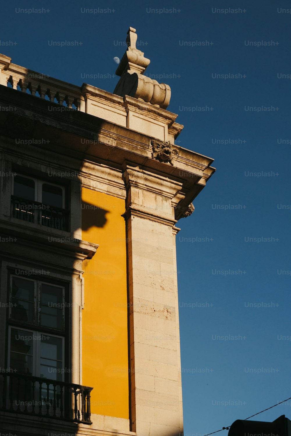 a tall building with a clock on the top of it