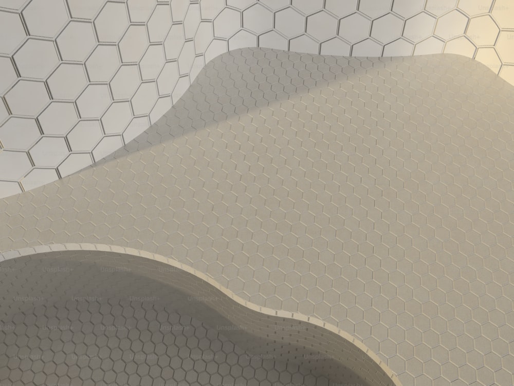a close up of a white tiled wall with hexagonal shapes