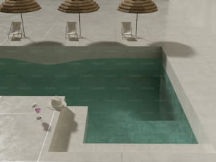 a pool with chairs and umbrellas next to it