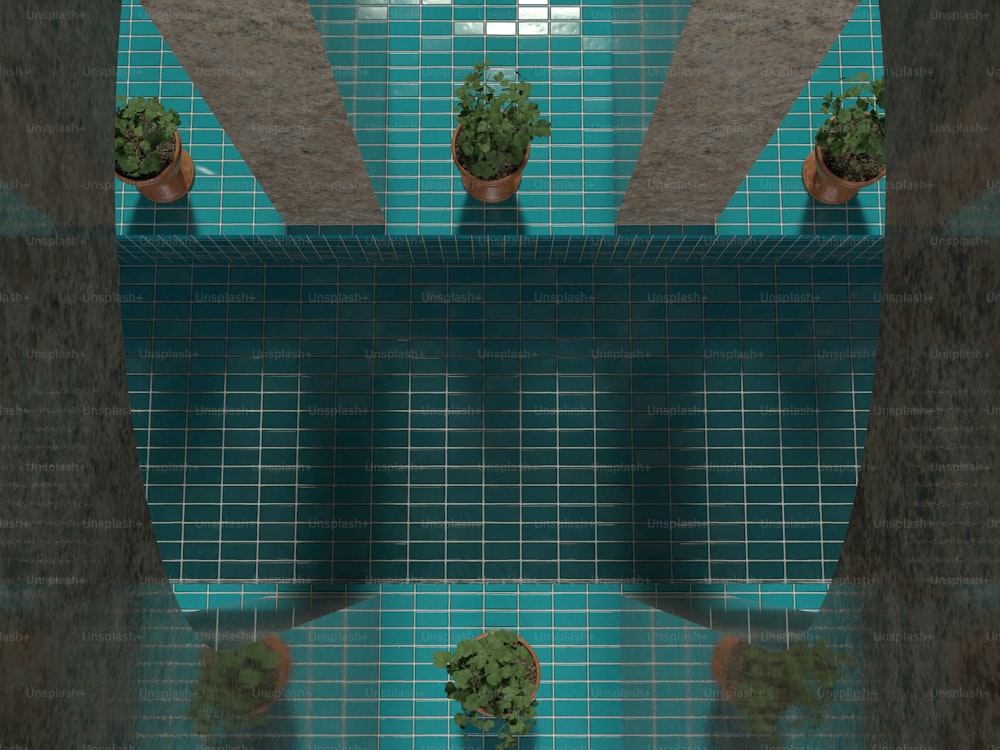 une salle de bain carrelée bleue avec des plantes en pot