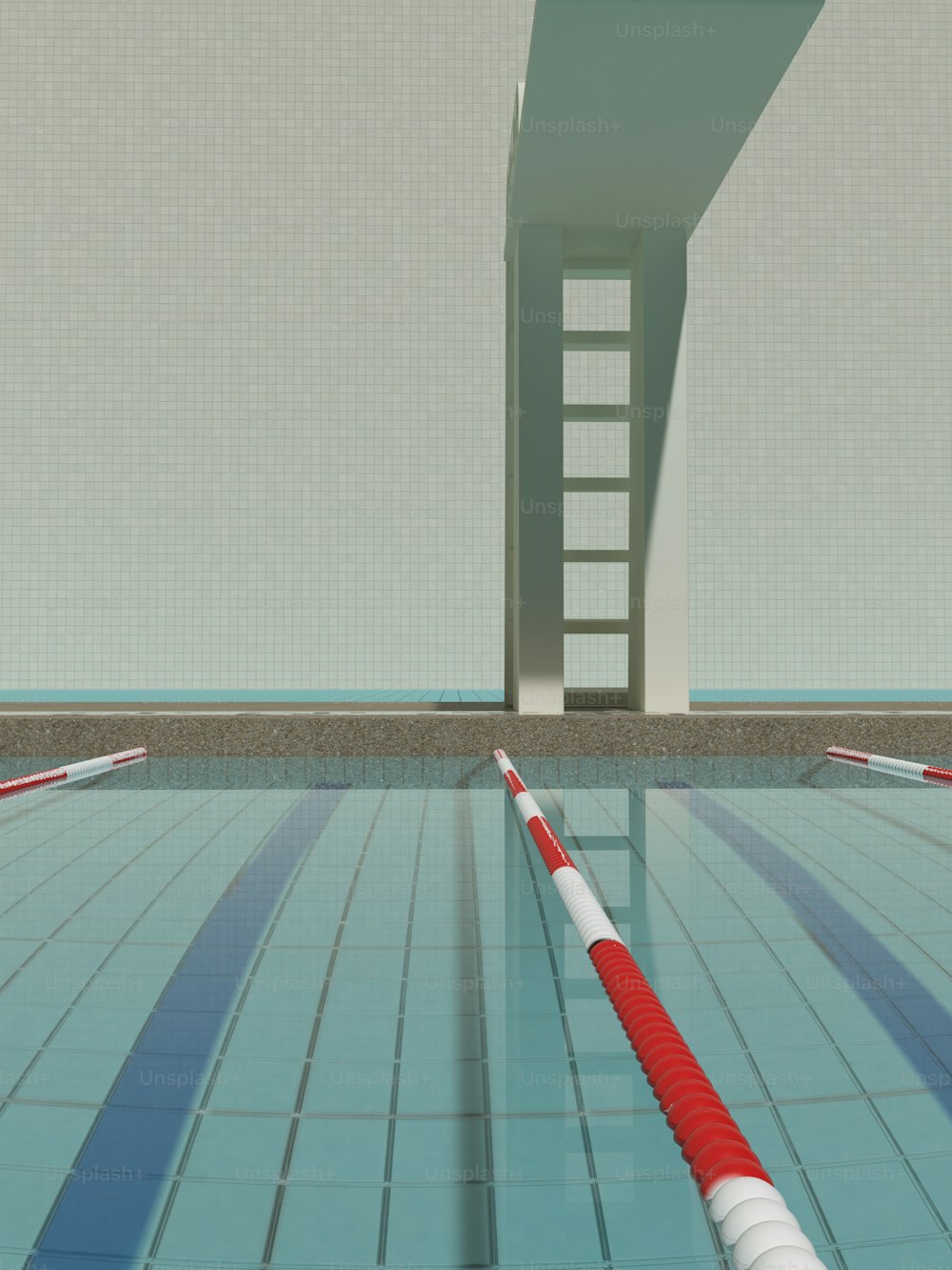 an empty swimming pool with a ladder in the background