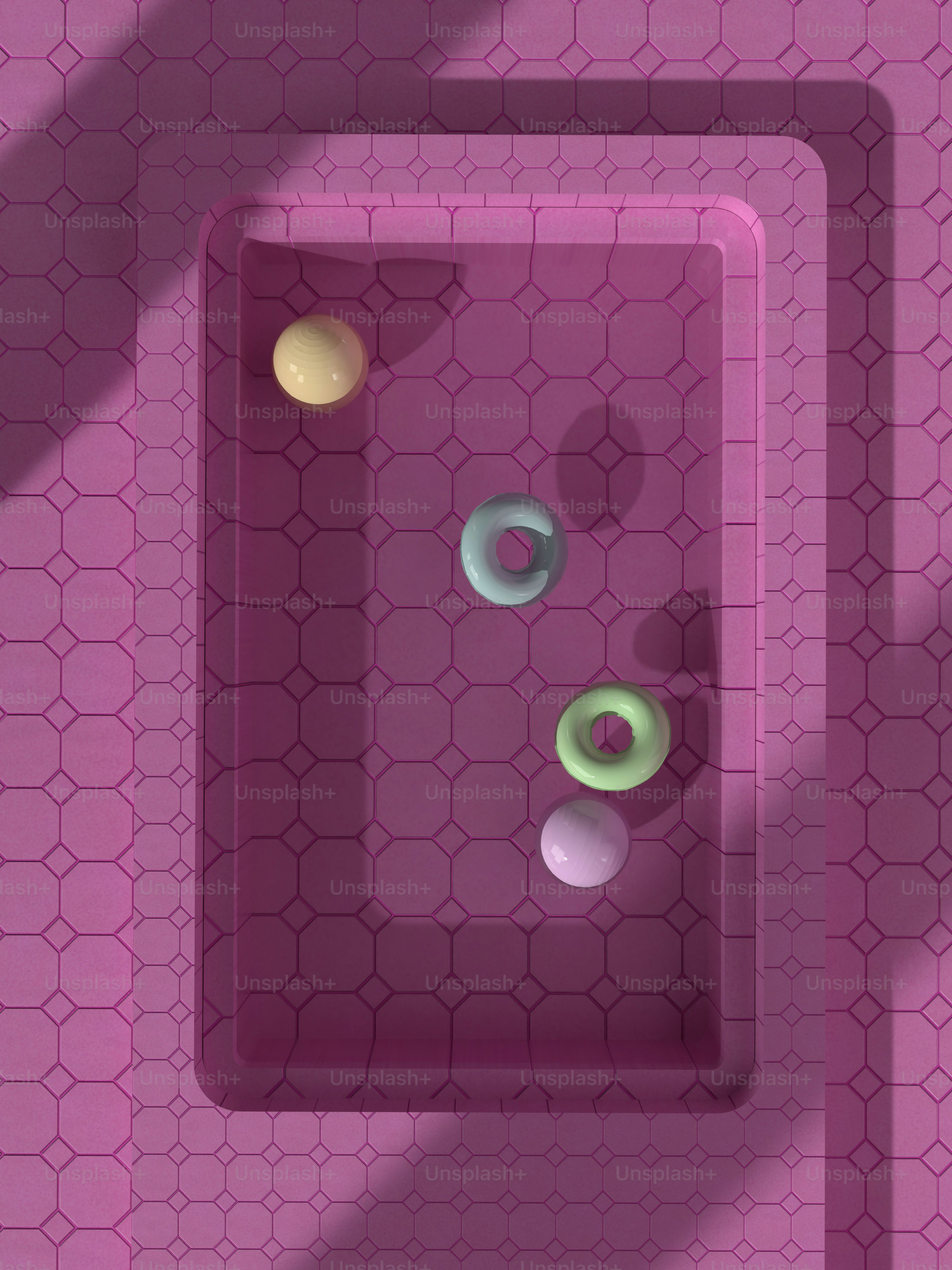 a bathroom with a pink tile floor and a pink sink