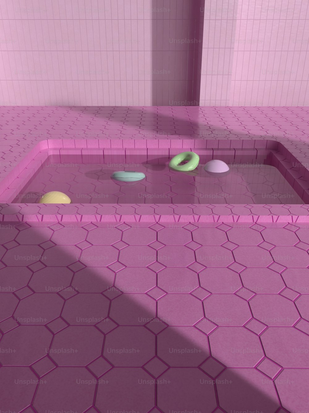 uma casa de banho com piso em azulejo rosa e paredes cor-de-rosa