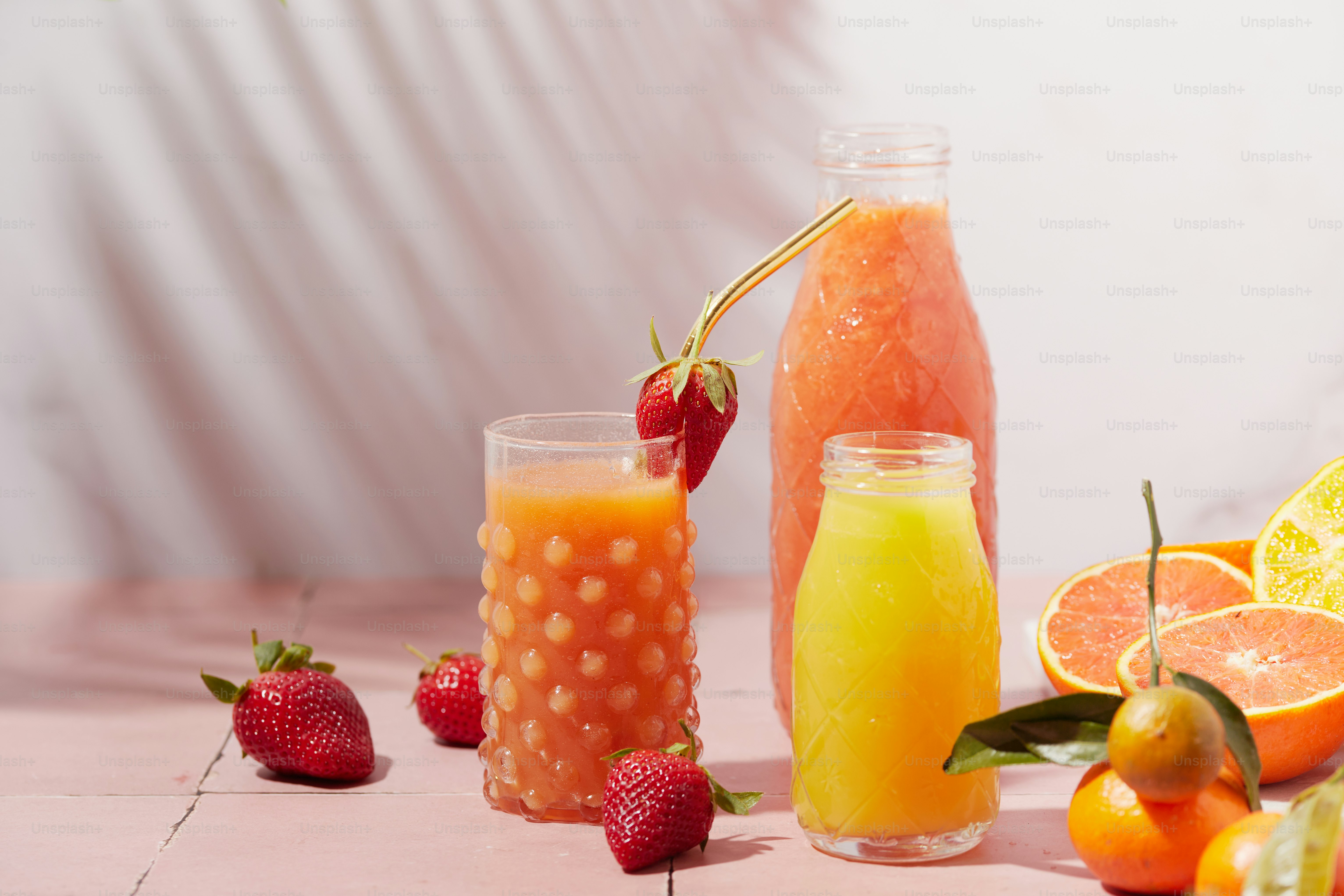 a variety of fruits and drinks on a table