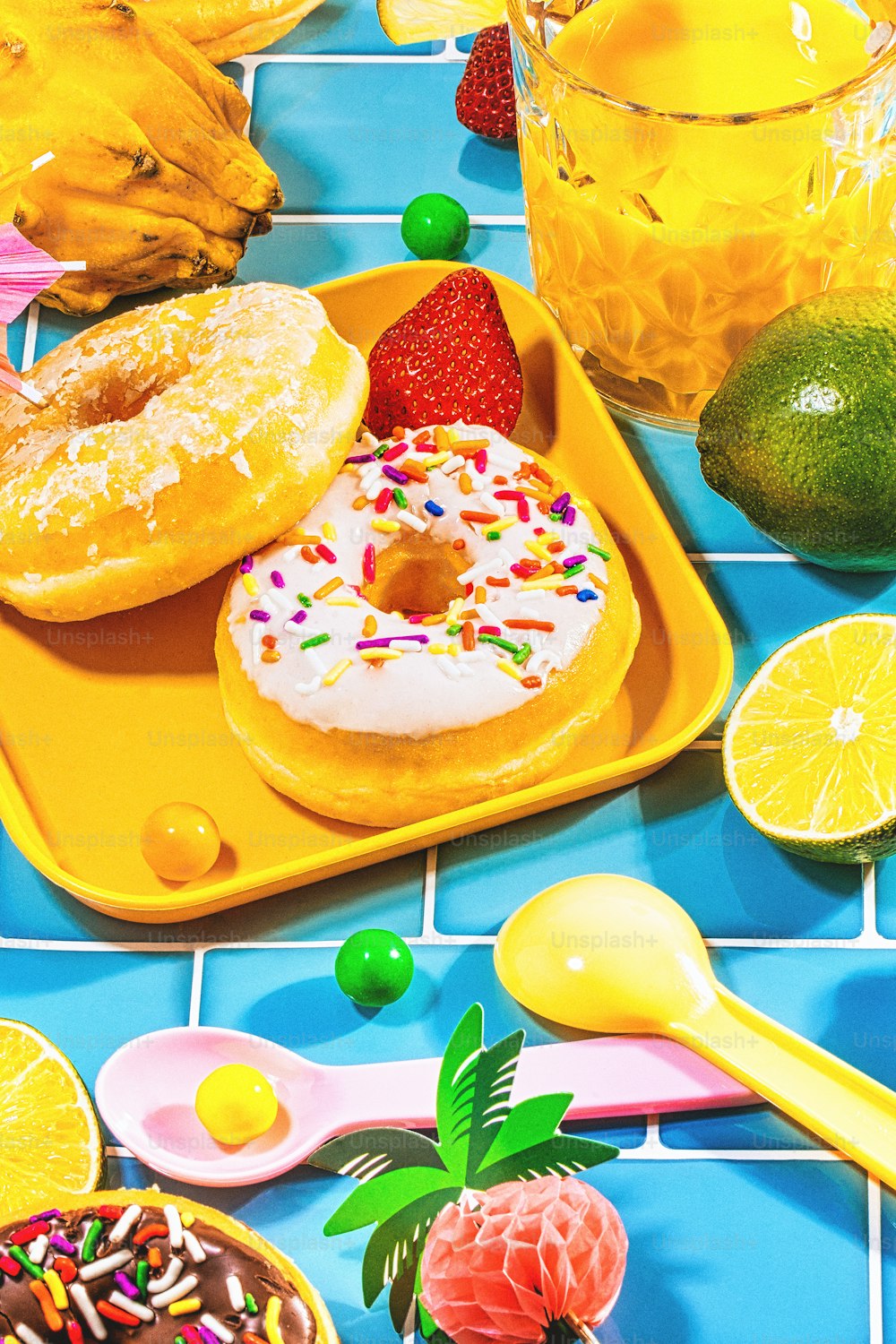 a tray of doughnuts on a blue tiled table