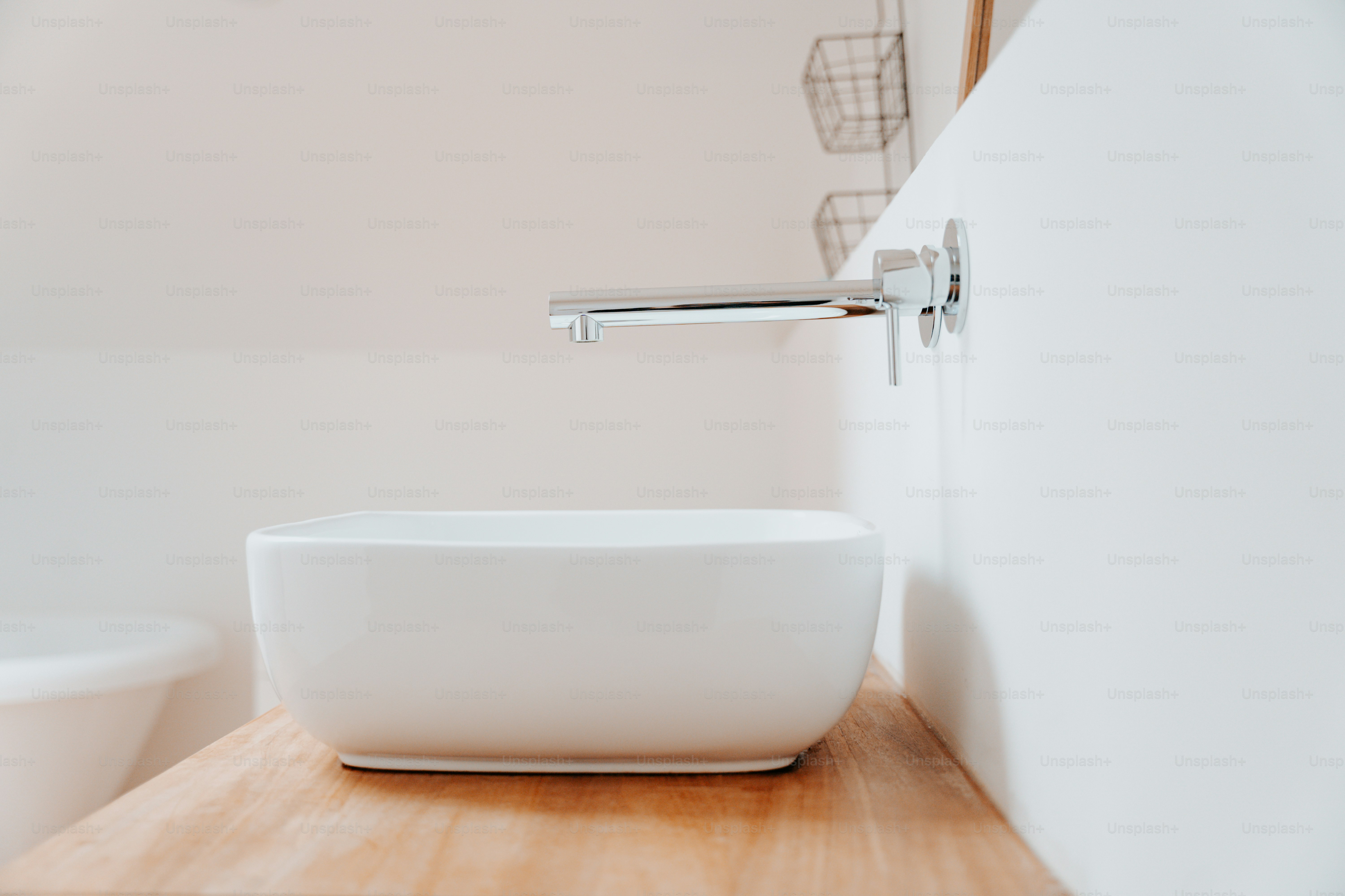 a white bowl sitting on top of a wooden counter