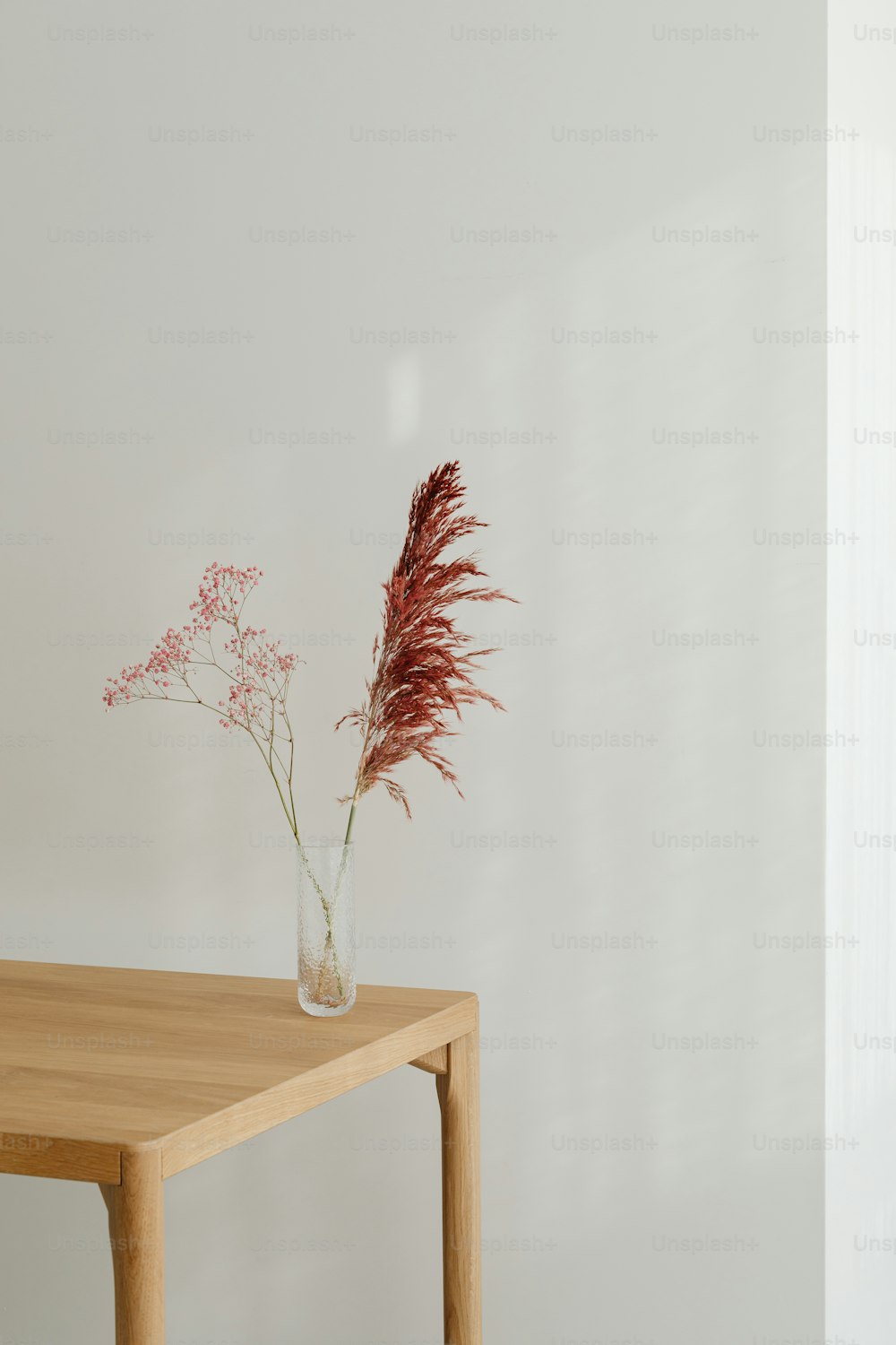 a vase with some flowers on a table