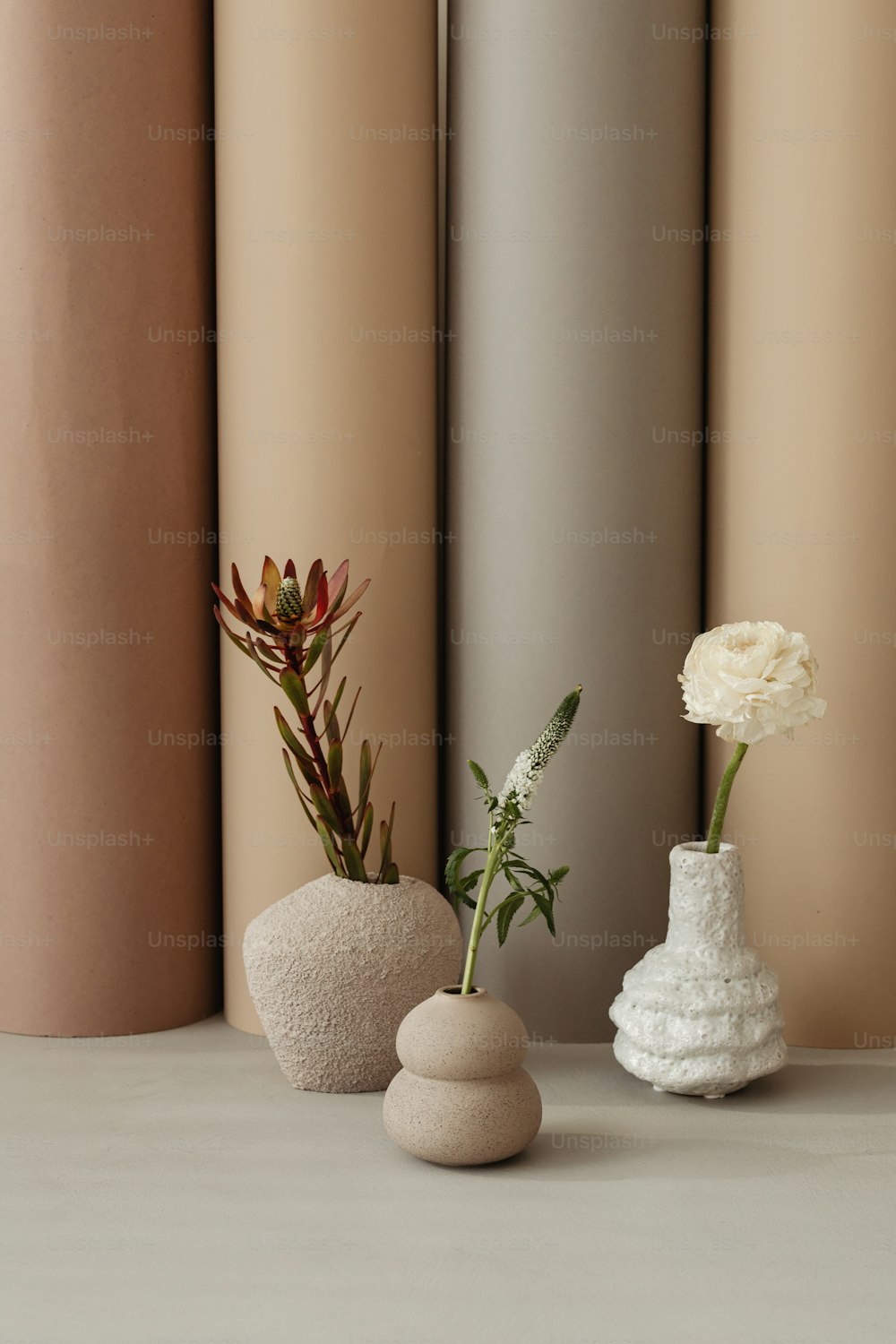 a couple of vases that are sitting on a table