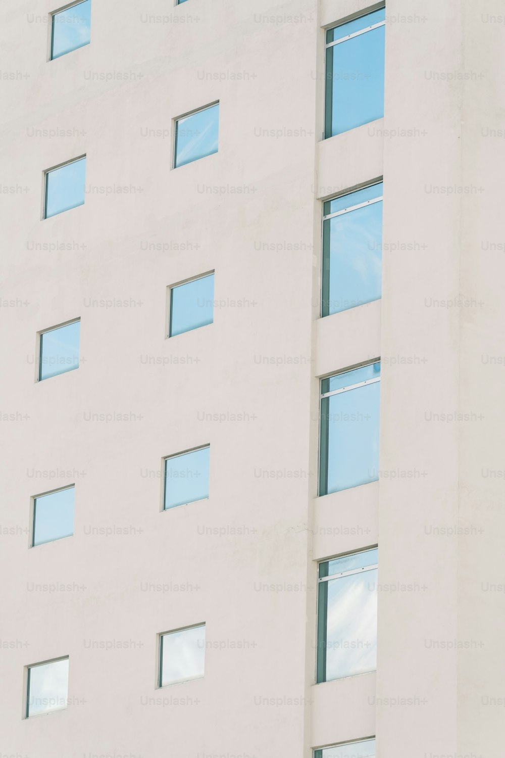 a large white building with many windows and a clock