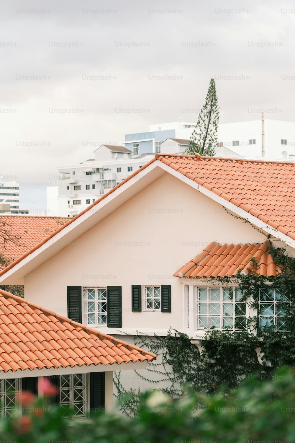 a white house with a red tiled roof