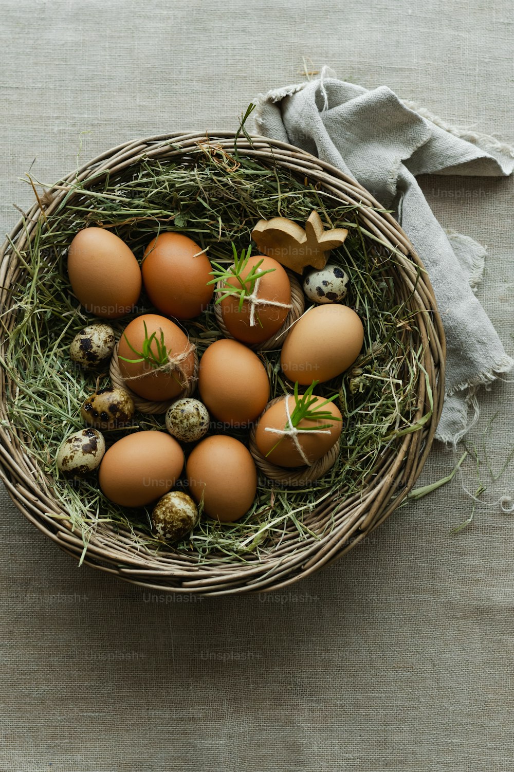 a basket filled with eggs sitting on top of a table