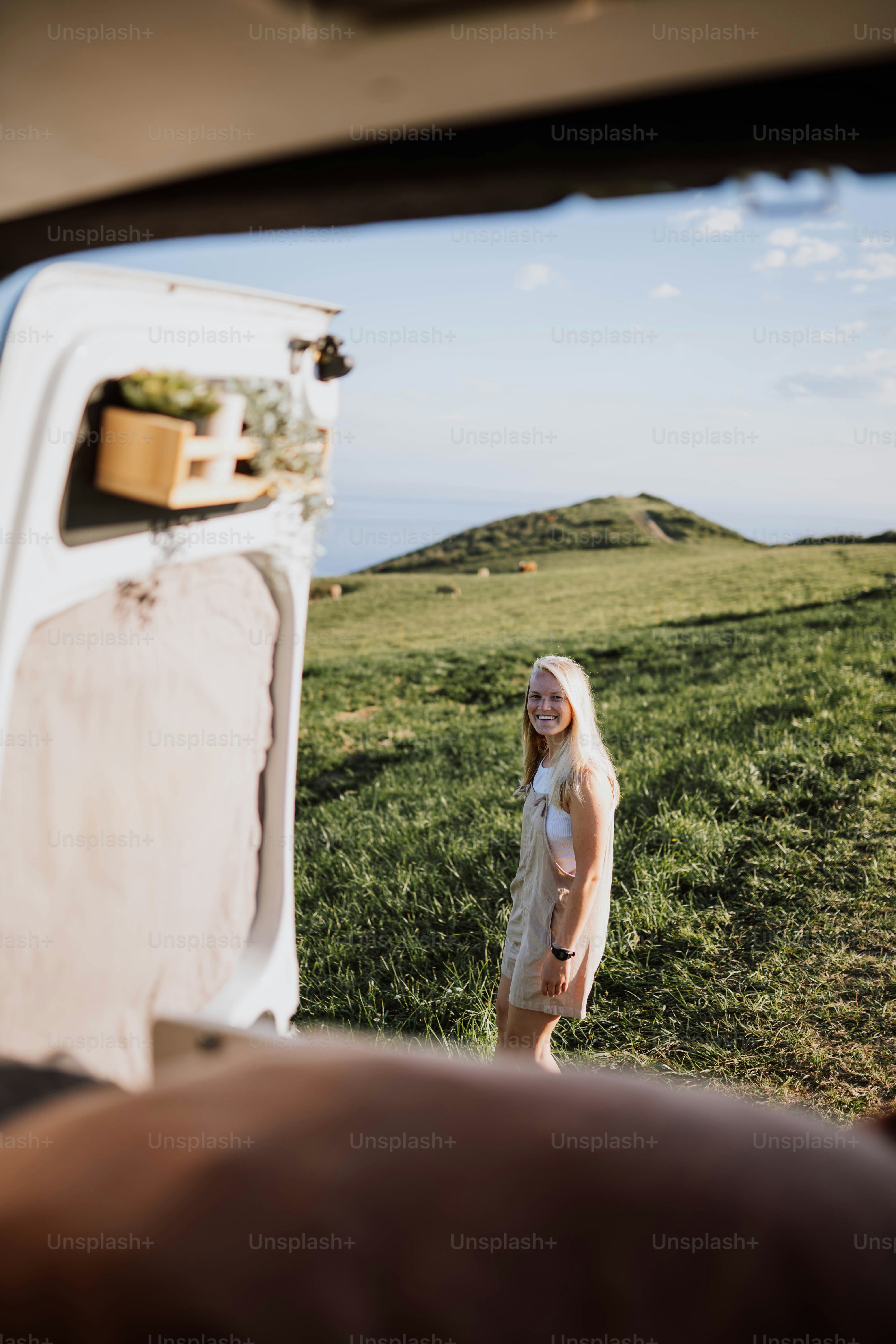 a woman standing next to an open refrigerator