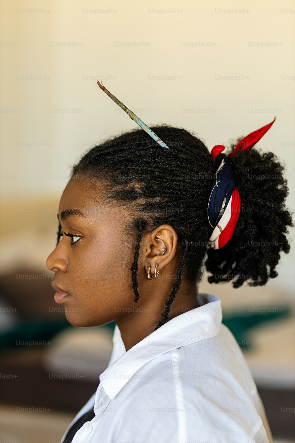 a woman with a pair of scissors in her hair