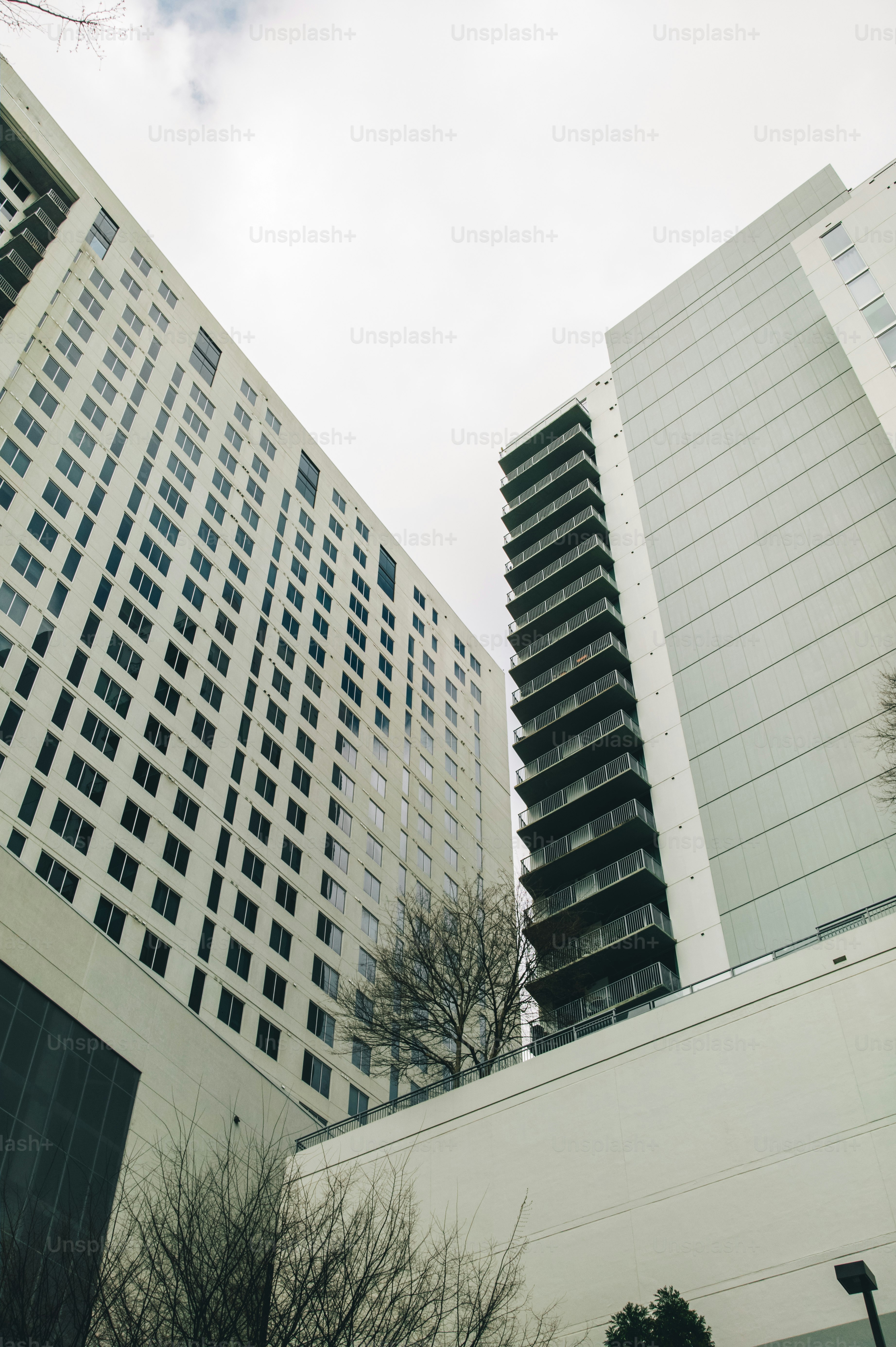 a couple of tall buildings sitting next to each other