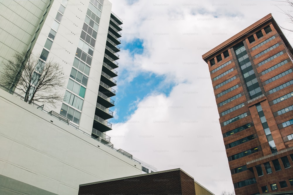 a couple of tall buildings sitting next to each other