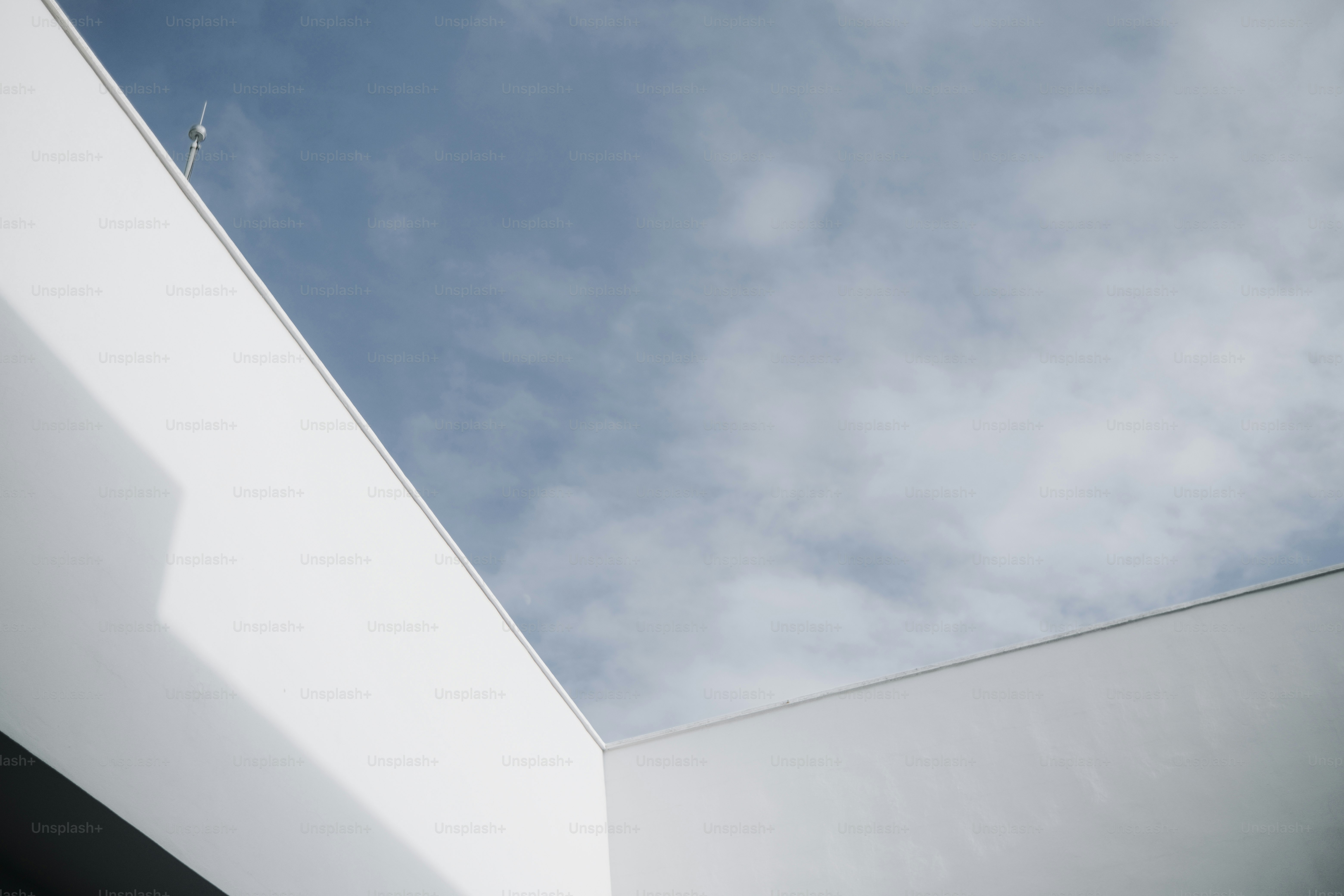 a white building with a blue sky in the background