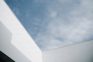 a white building with a blue sky in the background