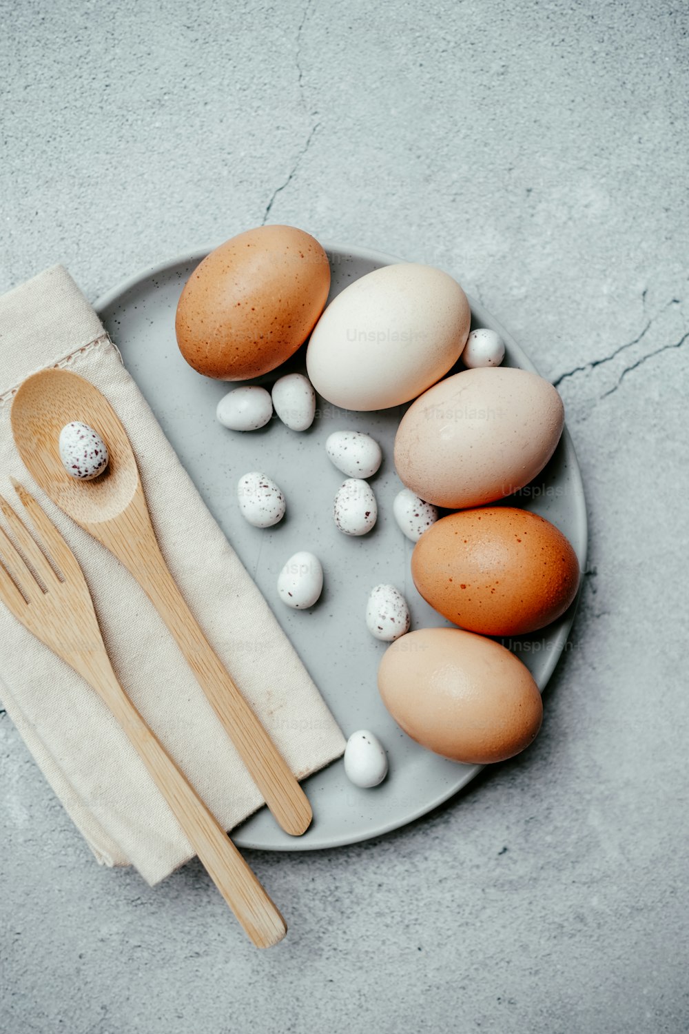 a plate with eggs, spoons and eggs on it