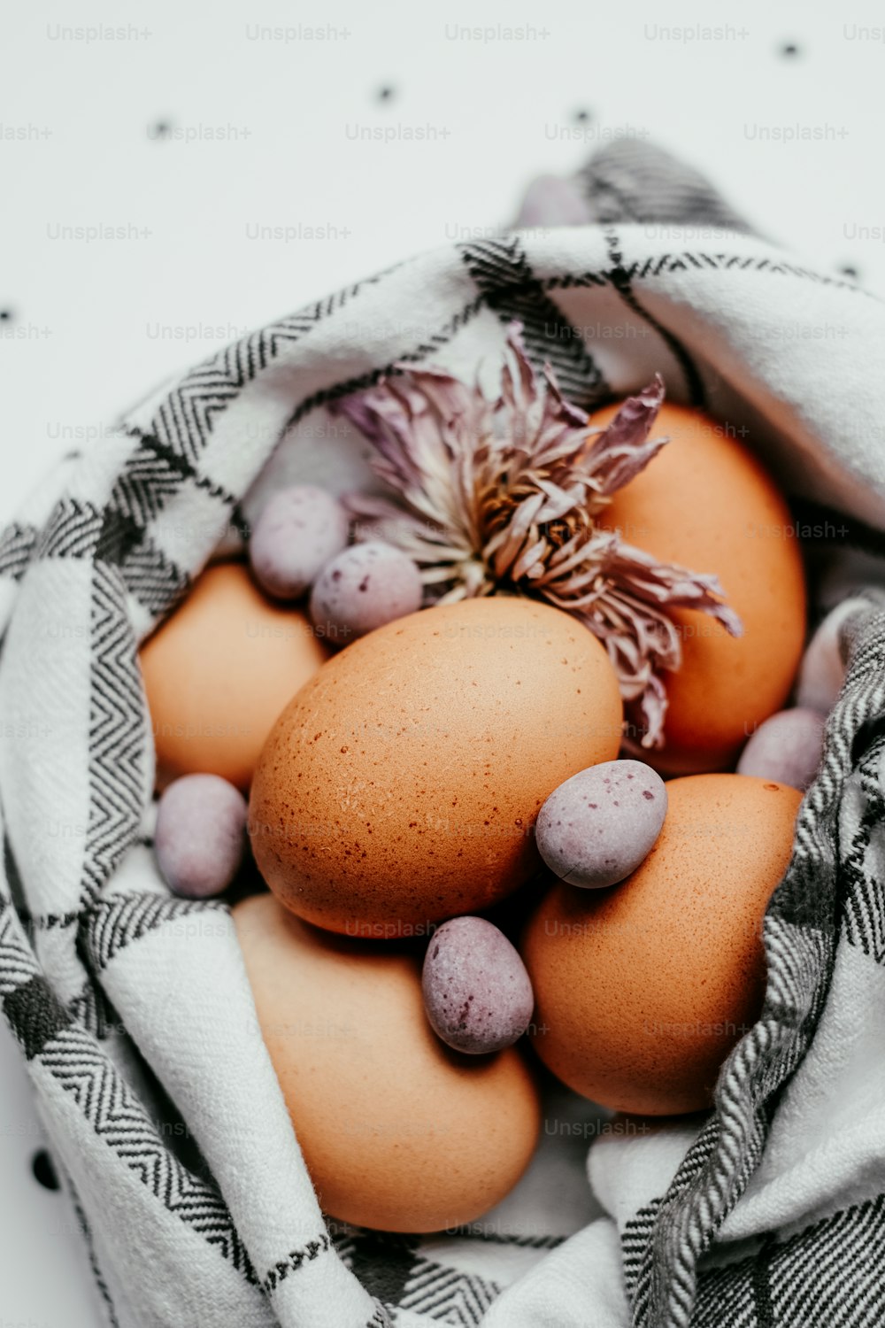 a basket filled with eggs on top of a table