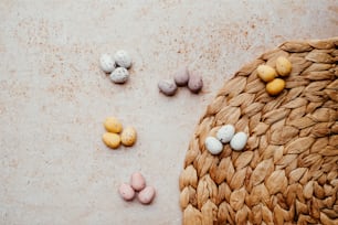 a basket filled with eggs sitting on top of a table