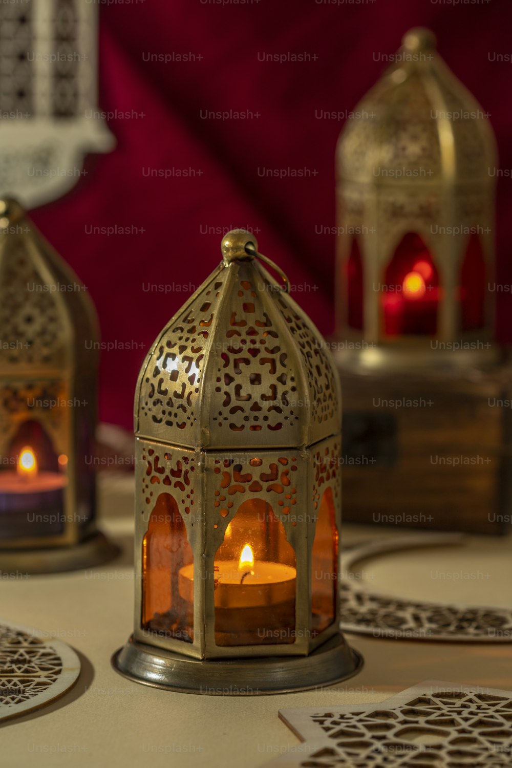 a candle is lit inside of a decorative lantern