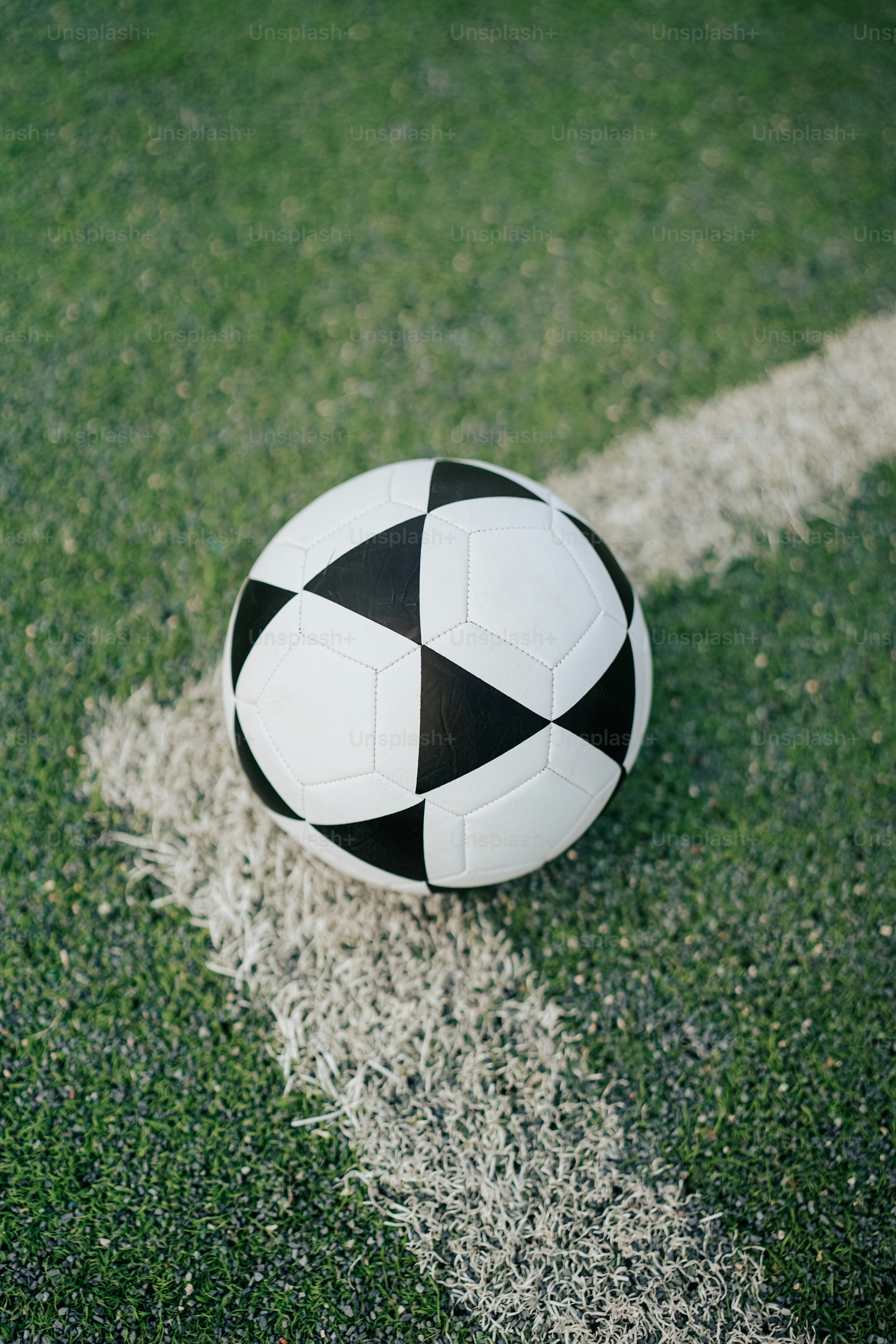 a soccer ball sitting on top of a soccer field