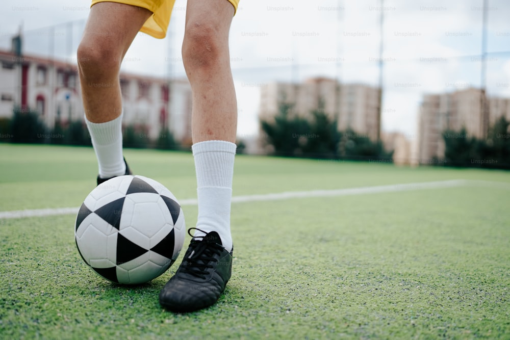 a soccer player with a soccer ball on a field