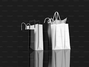 a black and white photo of three shopping bags