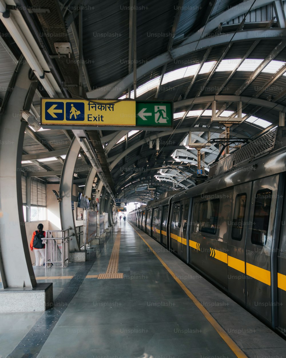 a subway train pulling into a train station