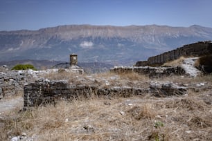 a view of a mountain range with a building in the foreground