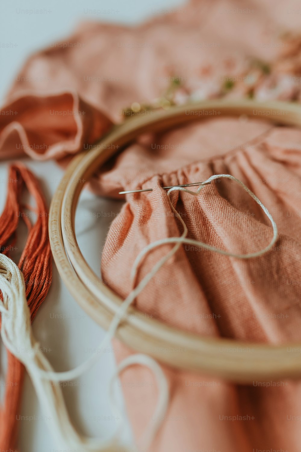 a close up of a piece of cloth and a hoop