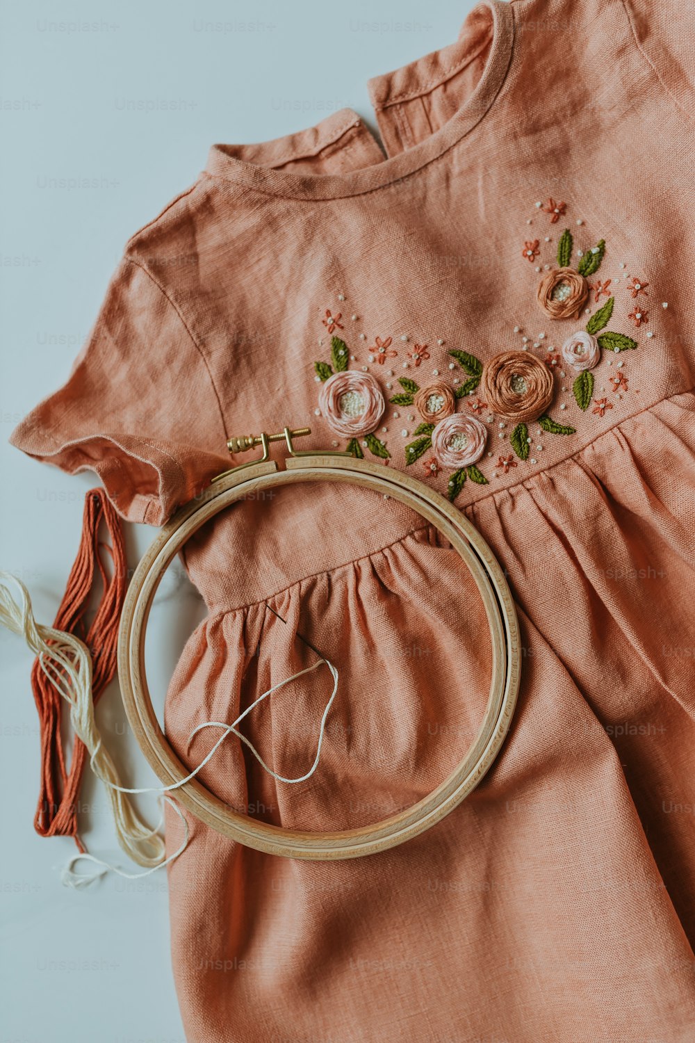 a close up of a dress with flowers on it