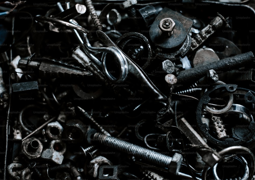 a pile of assorted wrenches and screws