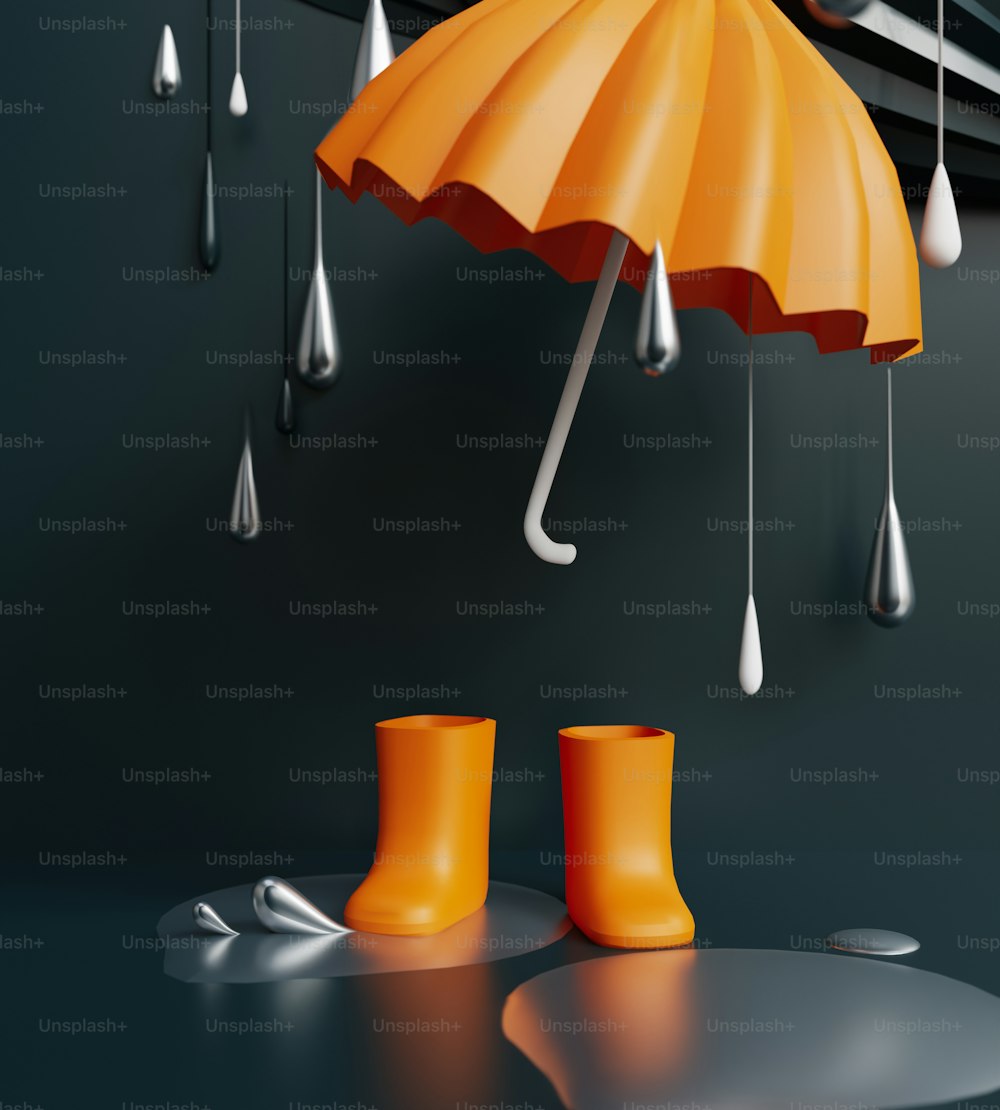 un paio di stivali gialli da pioggia e un ombrello